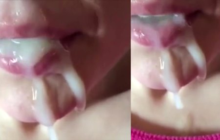 Девушка пьет густую сперму и лакомится облизывая сперму с губ.